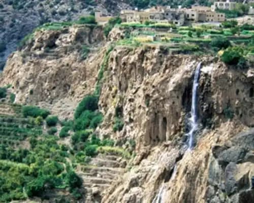 Terraced agricultural fields in a mountain valley, similar to Wadi Al Ayn, Yemen, during spring season