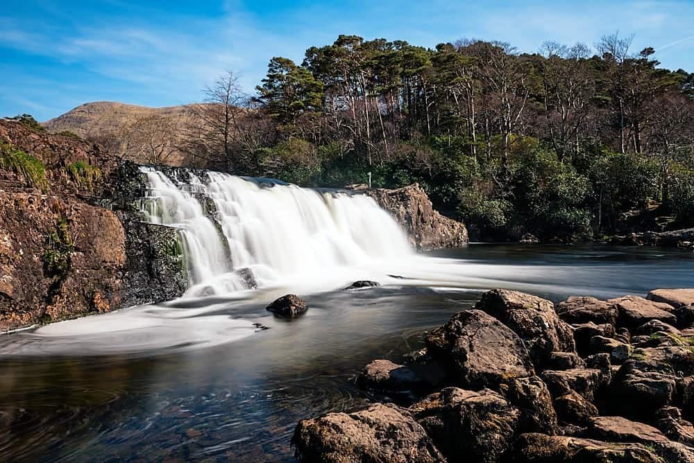 Aasleagh Falls waterfall and surrounding green landscape in County Mayo, Ireland