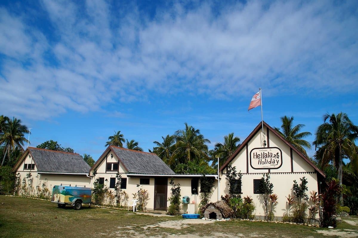Building exterior of a rural accommodation in Haveluloto, Tonga, surrounded by greenery