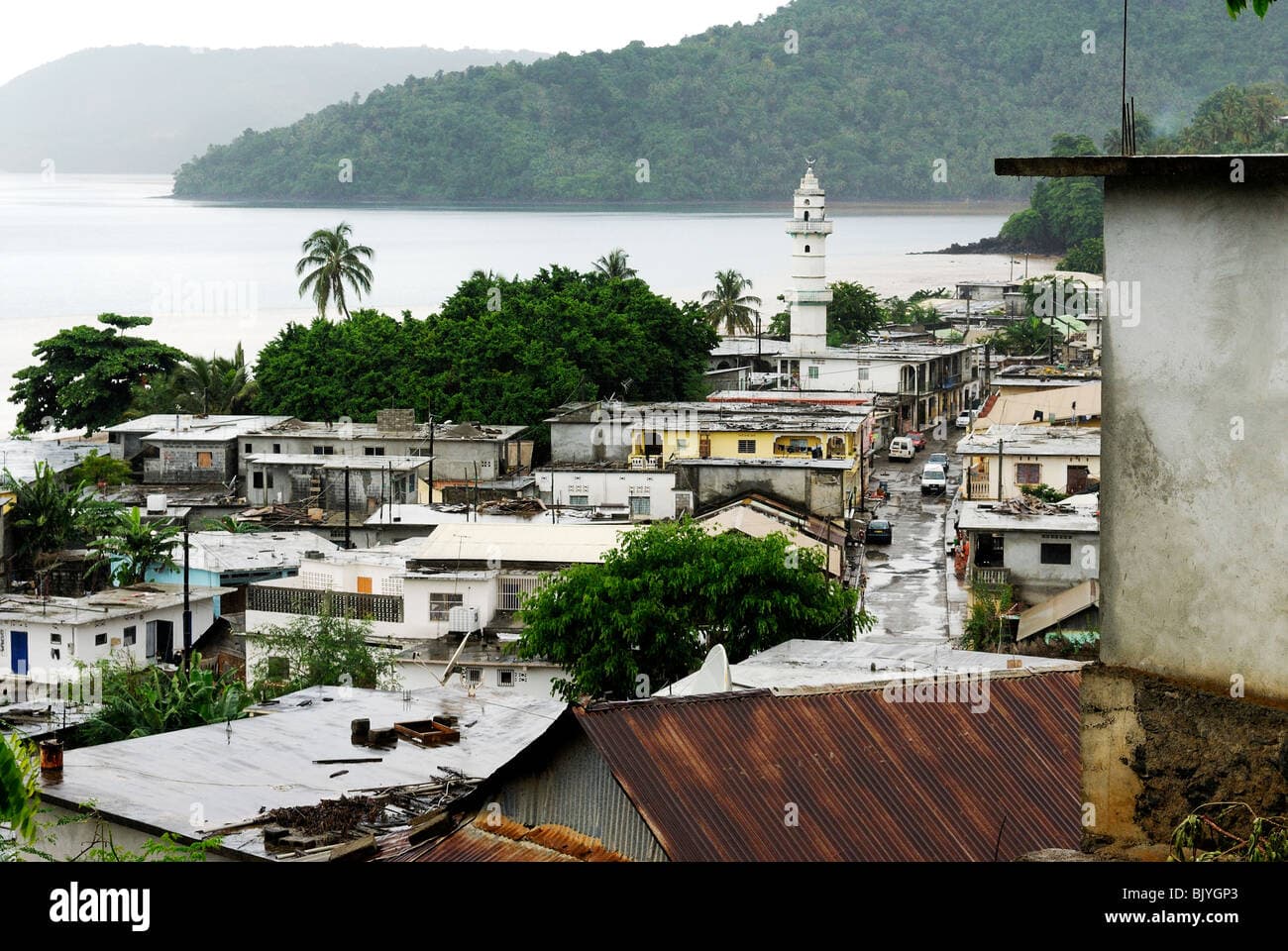 Street view of Kangani, Comoros, featuring market buildings and local commerce
