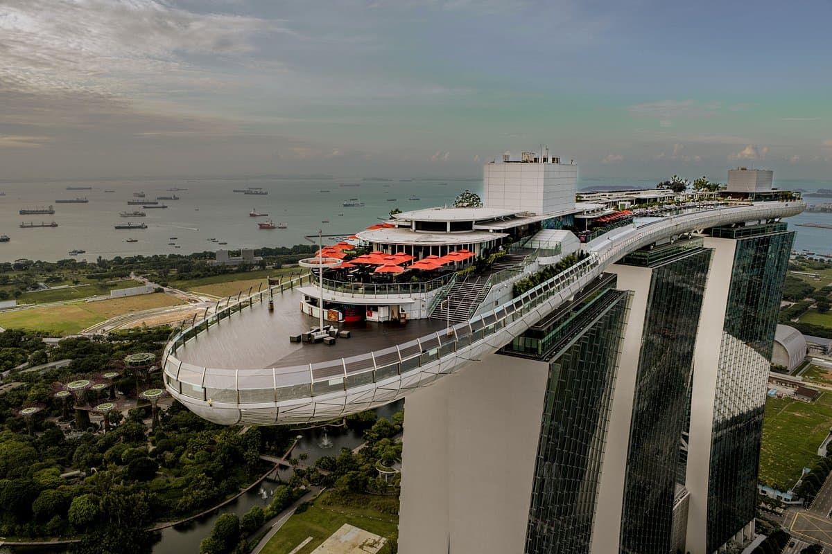 Modern architecture of Marina Bay Sands Hotel with the SkyPark bridge connecting the towers, Singapore skyline in the background