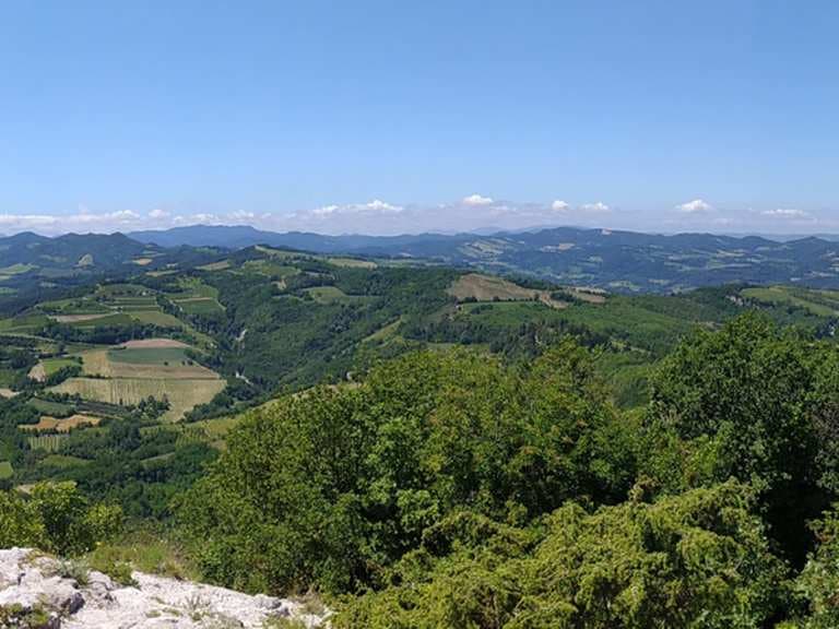 Landscape view of white gypsum geological formations and rocky terrain in the San Marino Nature Park