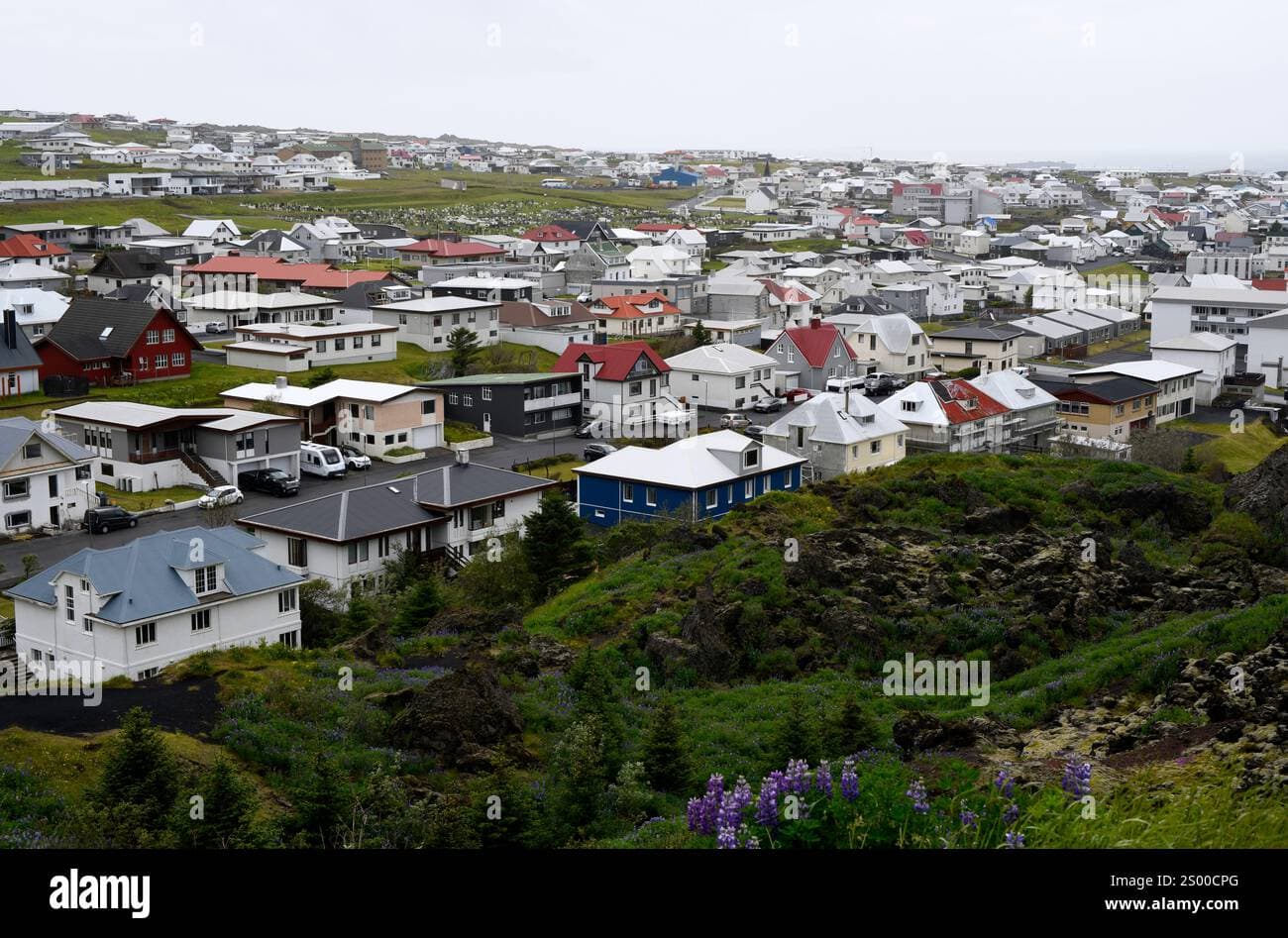 Aerial view of the city skyline and harbor of Vestmannaeyjar, Iceland, in spring