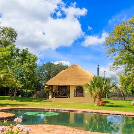 Exterior of a hotel building in Bulawayo, Zimbabwe, showing the facade and adjacent outdoor areas