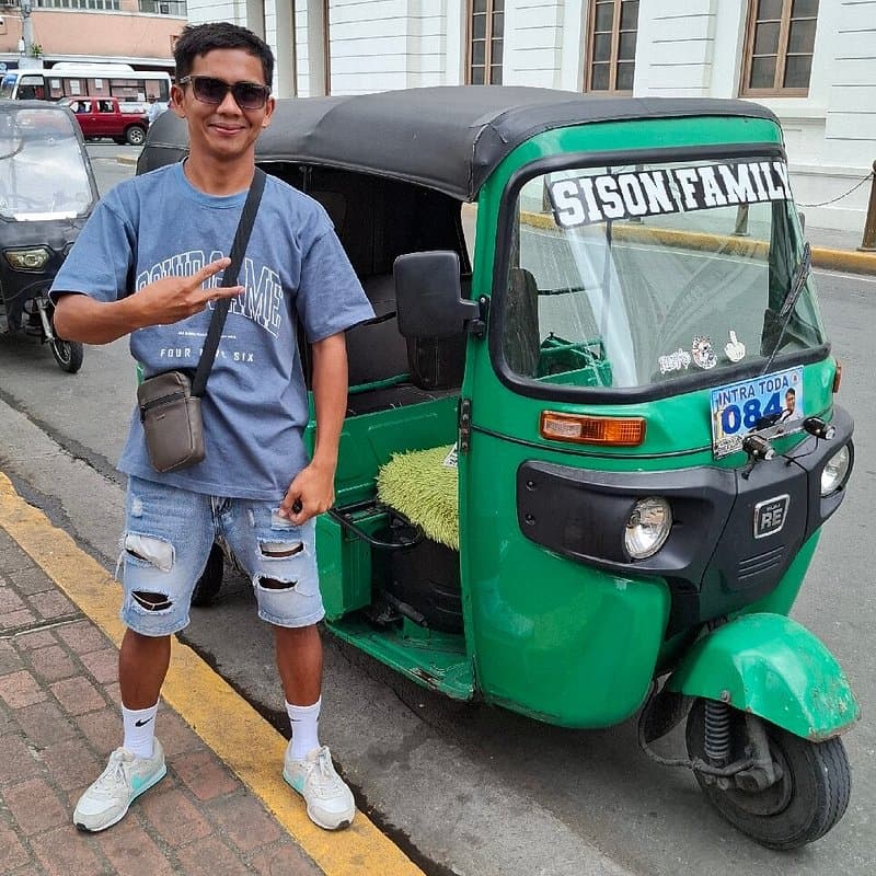 Local tricycle transportation vehicle and street architecture in Sison, Philippines.