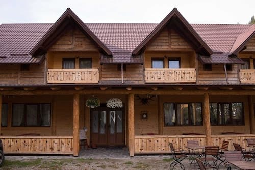 Street view of traditional houses in the village center of Avrămești, Romania, during spring