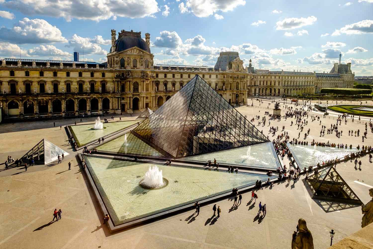 Louvre Museum Paris exterior with glass pyramid spring photo