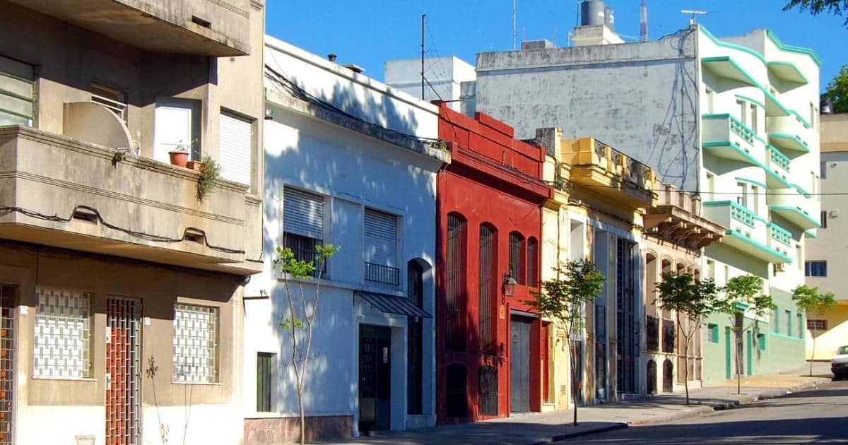 Colorful residential street with balconies and small trees in the Santiago Vázquez, Uruguay area