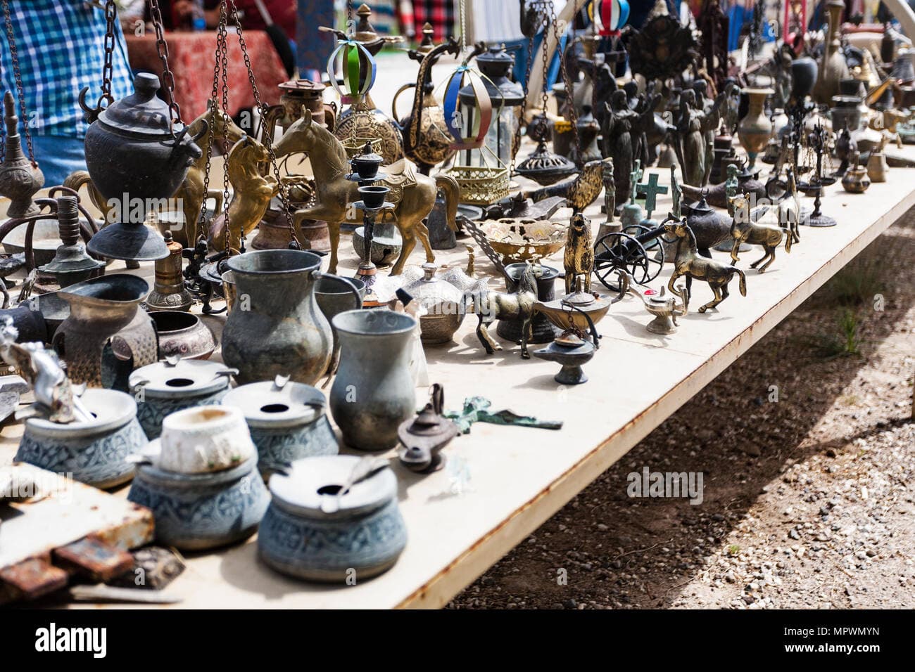 Outdoor market in Merkez, Turkey, featuring colorful handmade goods and traditional textiles