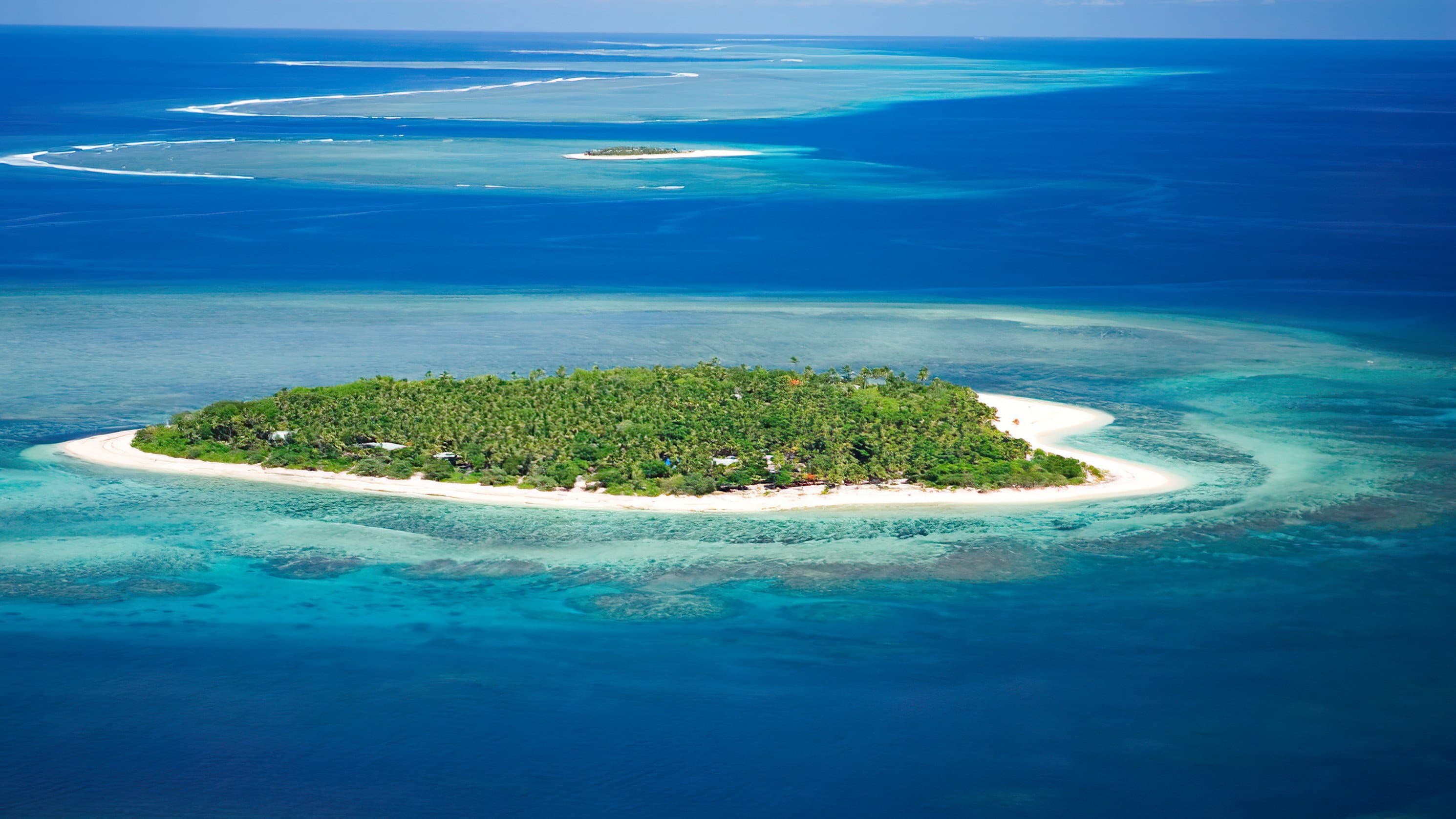 Aerial view of a small plane landing on Namotu Island in Lomaiviti Province, Fiji Islands
