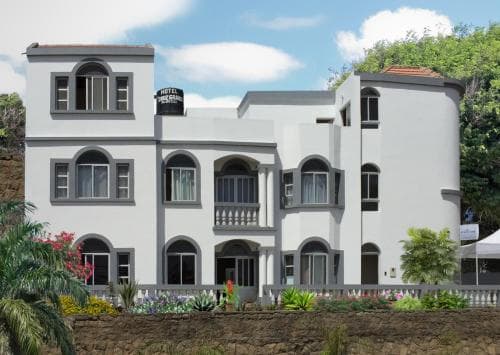 Exterior of a 3-star hotel in Vila do Maio, Cape Verde, featuring modern design with sea-facing balconies