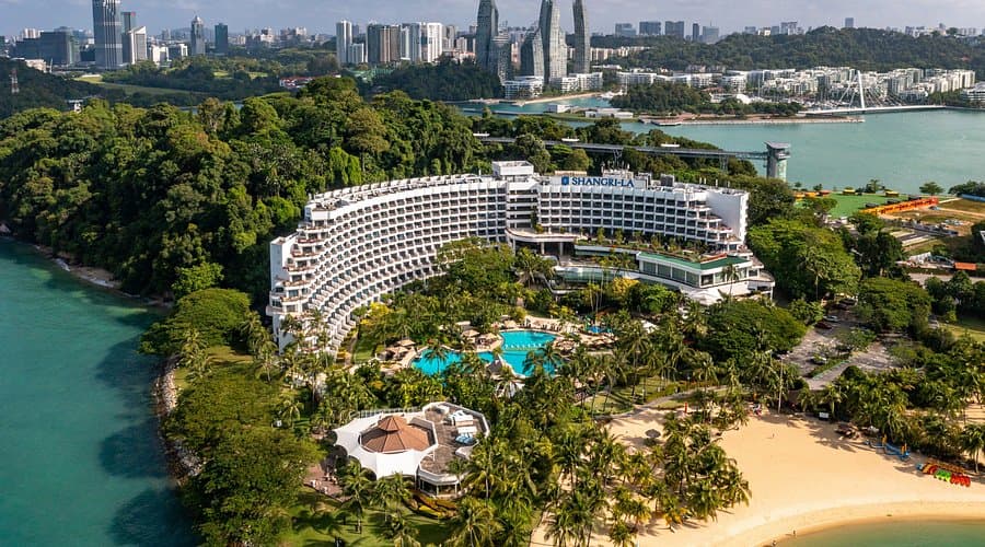 Exterior of Sofitel Singapore Sentosa Resort & Spa, showing beachfront location and tropical landscaping